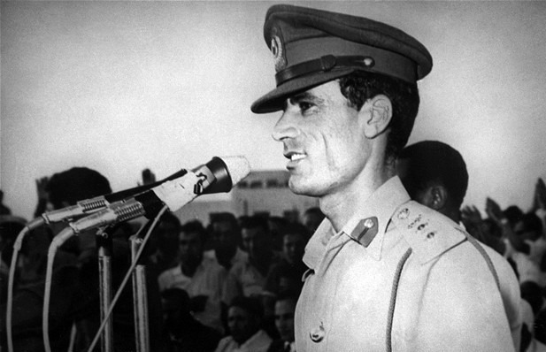 Ông Muammar Abu Minyar al-Gaddafi1 được gọi đơn giản là Đại tá Gaddafi; sinh năm 1942 đã là lãnh đạo trên thực tế của Libya từ một cuộc đảo chính năm 1969. Ông Muammar Abu Minyar al-Gaddafi1 được gọi đơn giản là Đại tá Gaddafi; sinh năm 1942 đã là lãnh đạo trên thực tế của Libya từ một cuộc đảo chính năm 1969.