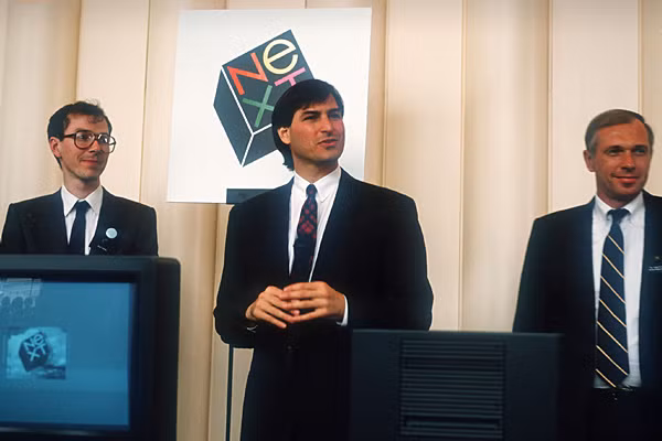 Steve Jobs rời Apple vào năm 1985 sau một cuộc tranh giành quyền lực với CEO John Sculley và thành lập công ty riêng mang tên NeXT. Hoạt động phát triển phần cứng không mấy thuận lợi nhưng phần mềm phát triển rất tốt, Apple mua NeXT vào năm 1997 và mời Jobs làm tư vấn.