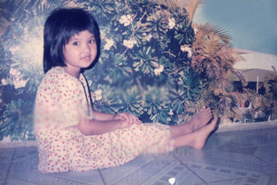 Mái tóc ngố và thuở răng sữa của "Nữ hoàng đồ lót". Ảnh: Kênh 14.