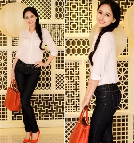 Chỉ với áo sơ mi, quần jeans kết hợp túi xách, giày màu đỏ cùng mái tóc tết dịu dàng, Hoa hậu Mai Phương Thuý nhận được rất nhiều lời khen ngợi của những nMỹ gười xung quanh.