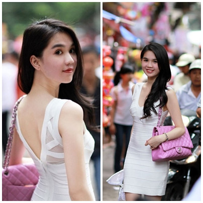 Trang phục dạo phố màu trắng của Ngọc Trinh có vẻ kín đáo hơn, nhưng vẫn đủ gợi cảm và lôi cuốn.