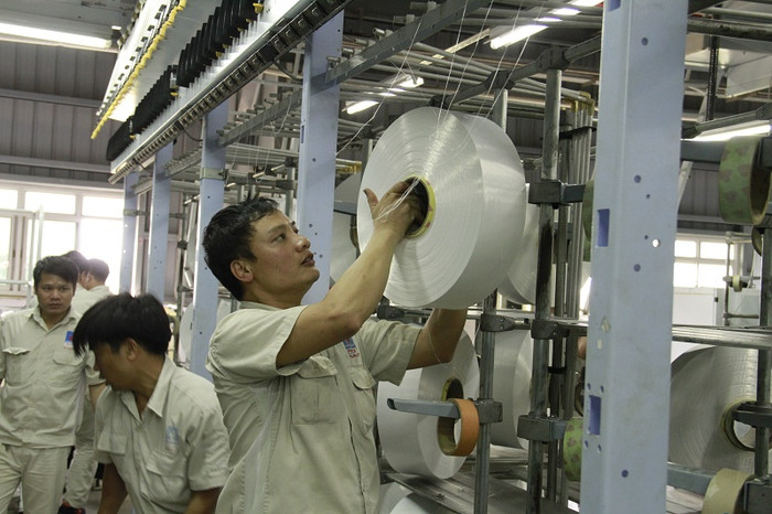 Người lao động tại Nhà máy Sơ xợi Đình Vũ Người lao động tại Nhà máy Sơ xợi Đình Vũ