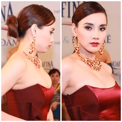 Trong một chương trình thời trang diễn ra gần đây, Trang Nhung xuất hiện trong chiếc đầm màu đỏ bordeaux cùng một bộ trang sức đính đá khá cồng kềnh, rối mắt.