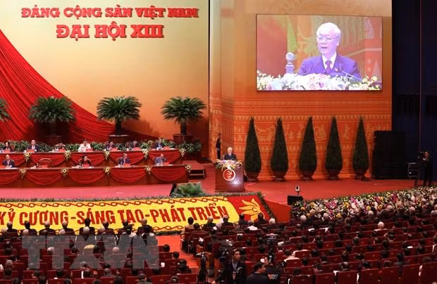 Đại hội nghe Tổng Bí thư Ban Chấp hành Trung ương Đảng, Chủ tịch nước Cộng hòa Xã hội Chủ nghĩa Việt Nam Nguyễn Phú Trọng đọc Báo cáo chính trị của Ban Chấp hành Trung ương Đảng khóa XII và các văn kiện trình Đại hội. (Ảnh: TTXVN) Đại hội nghe Tổng Bí thư Ban Chấp hành Trung ương Đảng, Chủ tịch nước Cộng hòa Xã hội Chủ nghĩa Việt Nam Nguyễn Phú Trọng đọc Báo cáo chính trị của Ban Chấp hành Trung ương Đảng khóa XII và các văn kiện trình Đại hội. (Ảnh: TTXVN)