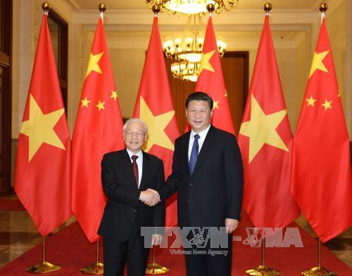 Tổng Bí thư, Chủ tịch nước Trung Quốc Tập Cận Bình đón Tổng Bí thư Nguyễn Phú Trọng. (Ảnh: Trí Dũng/TTXVN)