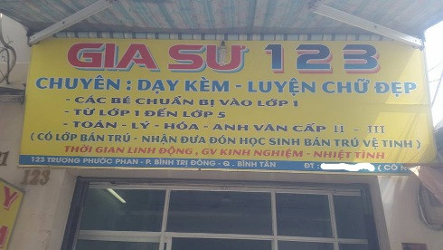 Bảng hiệu quảng cáo của cơ sở gia sư 123 ghi rõ: Dạy kèm và cả hoạt động bán trú (ảnh: P.L)