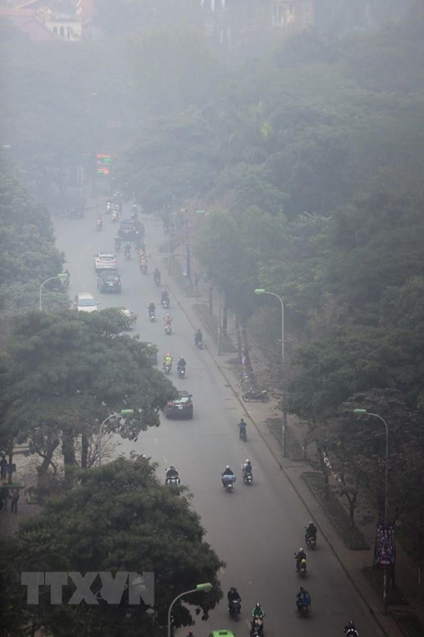 Phố Lê Thánh Tông quận Hoàn Kiếm chìm trong làn sương bụi mờ ảo. (Ảnh: Trọng Đạt/TTXVN) Phố Lê Thánh Tông quận Hoàn Kiếm chìm trong làn sương bụi mờ ảo. (Ảnh: Trọng Đạt/TTXVN)