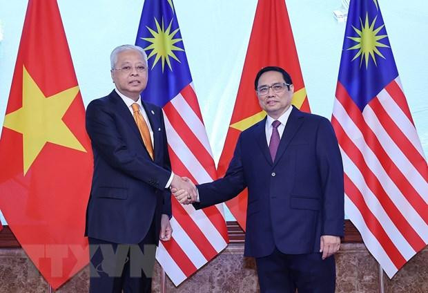 Thủ tướng Phạm Minh Chính và Thủ tướng Malaysia Dato’ Sri Ismail Sabri bin Yaakob chụp ảnh chung. (Ảnh: Dương Giang/TTXVN) Thủ tướng Phạm Minh Chính và Thủ tướng Malaysia Dato’ Sri Ismail Sabri bin Yaakob chụp ảnh chung. (Ảnh: Dương Giang/TTXVN)