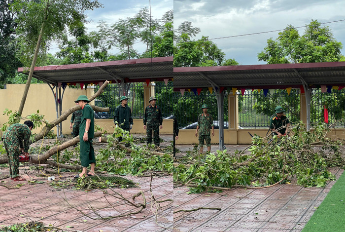 Các chiến sĩ công an, bộ đội hỗ trợ các trường khắc phục hậu quả sau bão. (Ảnh: Phòng Giáo dục và Đào tạo huyện Thanh Trì cung cấp) 658c8555f6aa51f408bb.jpg