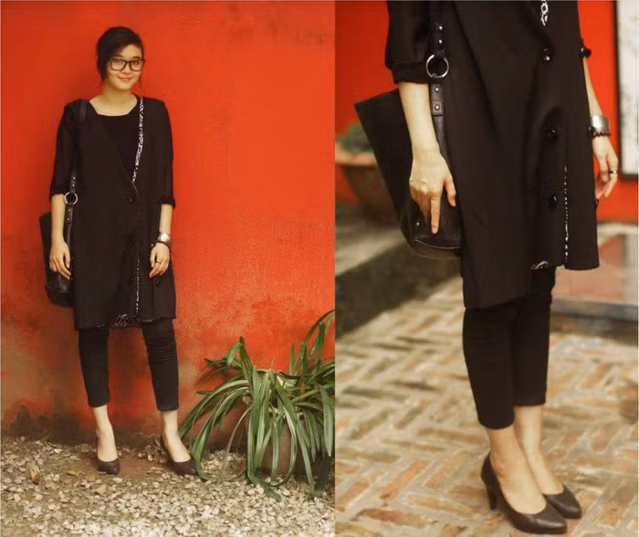 Ngay cả khi diện nguyên cả một cây đen xì xì, thì cô nàng B'los của chúng ta cũng chẳng có vẻ gì là già nua và nhàm chán. Chiếc ái gile dài dáng rộng với điểm nhấn thú vị viền áo, quần skinny lửng, một đôi giày cao gót và túi da quai dài. Style này cũng thật ấn tượng và thú vị phải không?