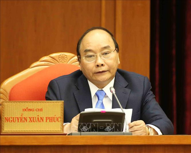 Thủ tướng Chính phủ Nguyễn Xuân Phúc trình bày Báo cáo tiếp thu, giải trình ý kiến của Trung ương. Ảnh: Phương Hoa/TTXVN Thủ tướng Chính phủ Nguyễn Xuân Phúc trình bày Báo cáo tiếp thu, giải trình ý kiến của Trung ương. Ảnh: Phương Hoa/TTXVN
