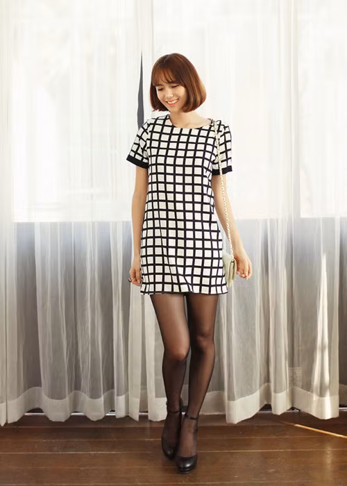 Váy suông với độ dài vừa phải sẽ giúp bạn ăn gian được kha khá chiều cao, đặc biệt phù hợp với những cô nàng có vóc dáng nhỏ bé