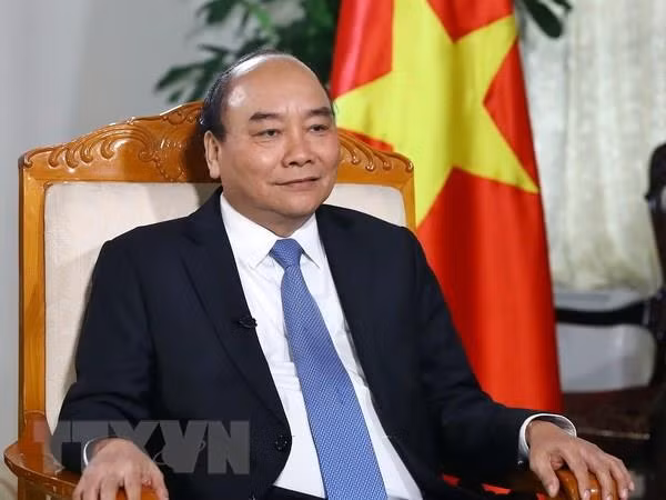 Thủ tướng Chính phủ Nguyễn Xuân Phúc trả lời phỏng vấn báo chí. Ảnh: TTXVN