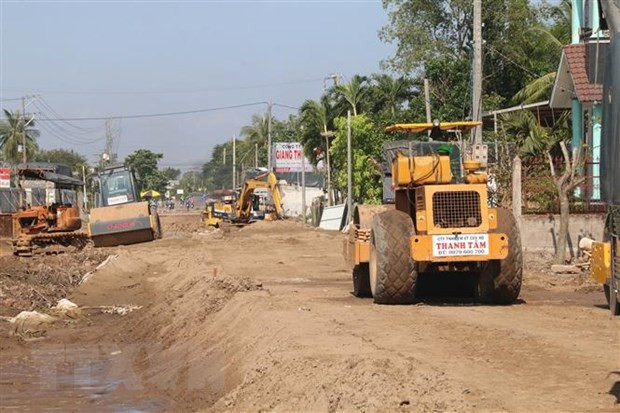 Thi công nút giao với Quốc lộ 30 (Cái Bè) thuộc Cao tốc Trung Lương-Mỹ Thuận. (Ảnh: Minh Trí/TTXVN)