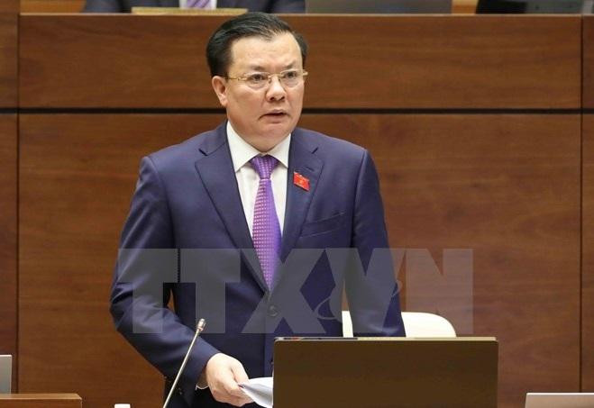 Bộ trưởng Đinh Tiến Dũng trong một phiên trả lời chất vấn tại Quốc hội. Ảnh: TTXVN. Bộ trưởng Đinh Tiến Dũng trong một phiên trả lời chất vấn tại Quốc hội. Ảnh: TTXVN.