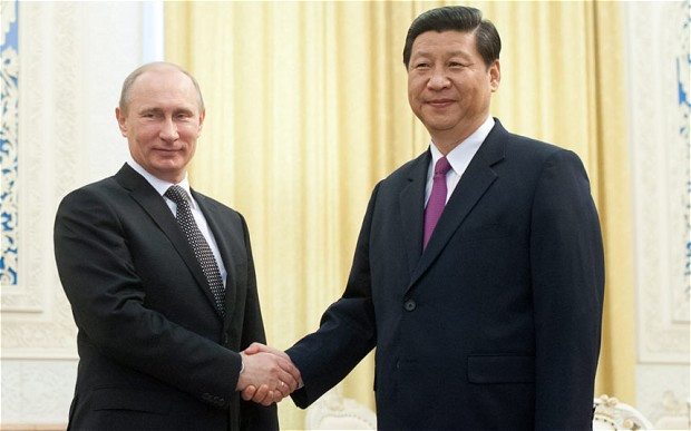 Tổng thống Nga Vladimir Putin (trái) và Tổng bí thư đảng Cộng sản Trung Quốc Tập Cận Bình. Tổng thống Nga Vladimir Putin (trái) và Tổng bí thư đảng Cộng sản Trung Quốc Tập Cận Bình.