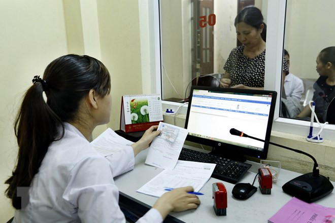 Tham gia bảo hiểm y tế là quyền lợi của mọi người dân. ảnh minh họa: TTXVN.