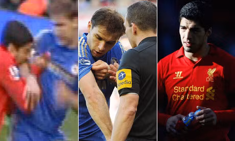 Suarez cắn đối thủ.