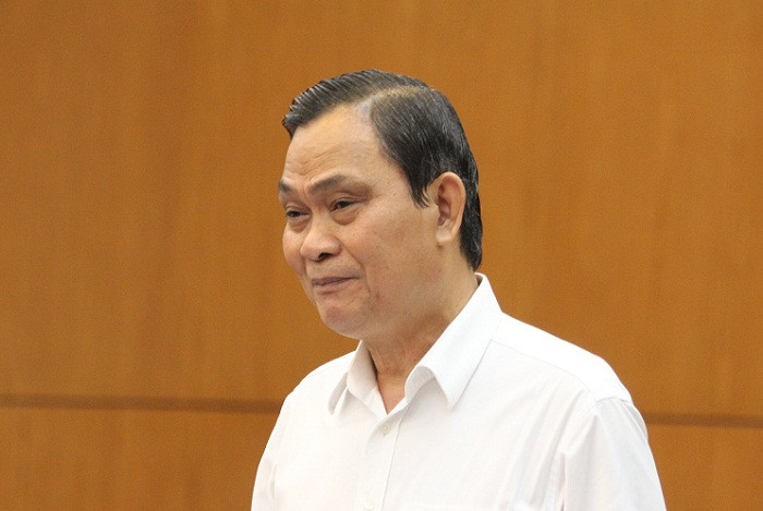 Bộ trưởng Bộ Nội vụ - ông Nguyễn Thái Bình trình bày báo cáo giải trình về dự thảo Luật tổ chức Chính phủ sáng 9/4. ảnh: Ngọc Quang.