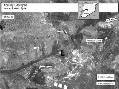 Ảnh chụp ngày 31/5 tại Ar Rastan cho thấy sự hiện diện của các ụ pháo