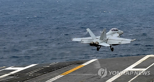F/A-18 Super Hornet cất cánh từ tàu sân bay USS George Washington khi tham gia tập trận chung với quân đội Hàn Quốc trên biển Hoàng Hải ngày 24/6. F/A-18 Super Hornet cất cánh từ tàu sân bay USS George Washington khi tham gia tập trận chung với quân đội Hàn Quốc trên biển Hoàng Hải ngày 24/6.