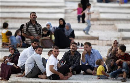 Người tị nạn Syria tại khu vực biên giới với Jordan. Ảnh Reuters Người tị nạn Syria tại khu vực biên giới với Jordan. Ảnh Reuters