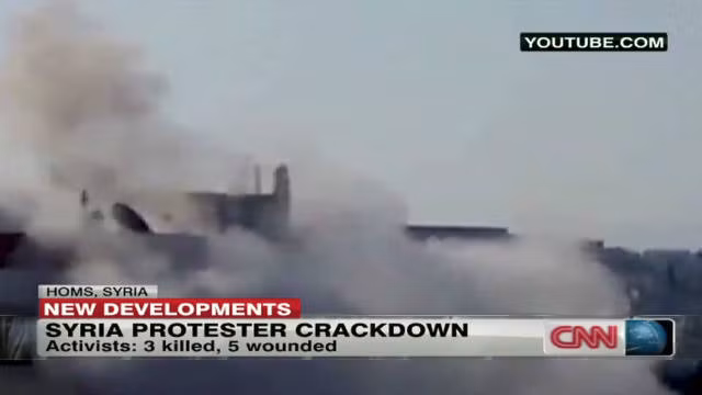 Khói lửa trong một cuộc xung đột giữa quân chính phủ và lực lượng nổi dậy Syria tại thành phố Homs