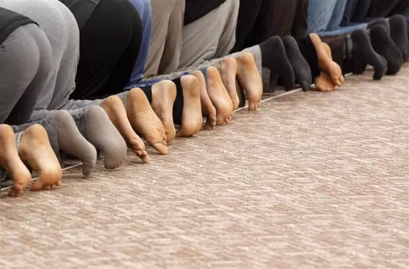 Người tị nạn Syria cầu nguyện tại một nhà thờ tạm thời trong trại tị nạn ở Boynuyogun, Hatay, Thổ Nhĩ Kỳ ngày 8/2/2012.
