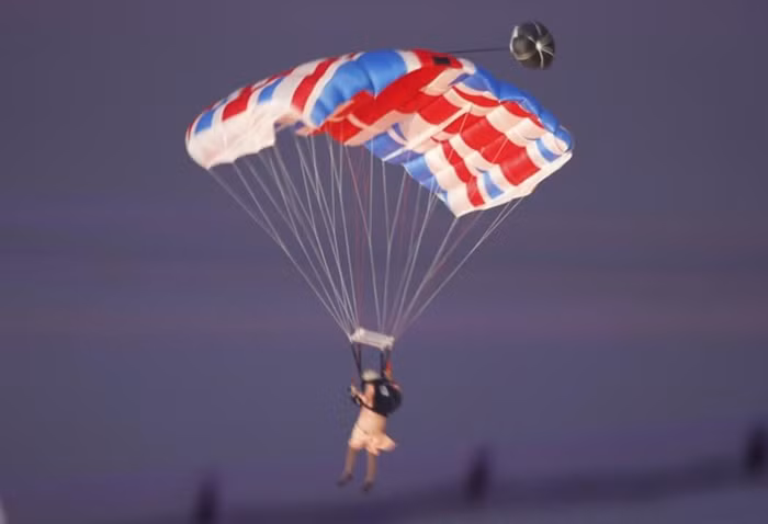 Một VĐV nhảy dù phục sức giống với nữ hoàng Elizabeth “đổ bộ” xuống sân Olympic.