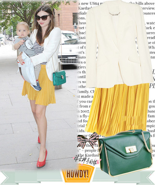 Siêu mẫu Miranda Kerr nhẹ nhàng trong mùa thu với váy xếp li cùng áo khoác.