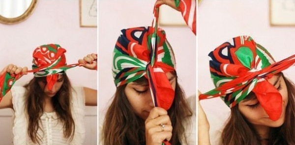 Quấn quanh đầu rồi thắt nút đầu tiên trước trán.