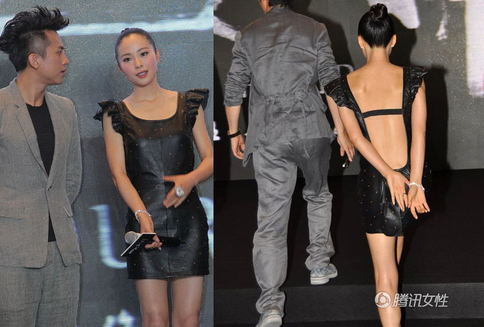 Diên váy hở lưng quá sâu khiến Giang Nhất Yến phải ý tứ dùng tay che vòng ba.