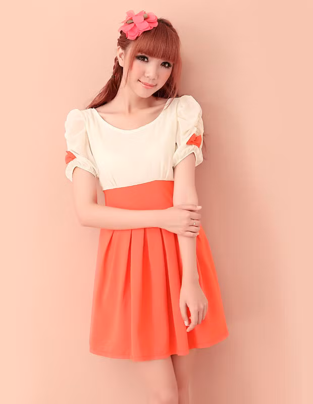 Hai màu cam và trắng phối hợp hài hòa làm nổi bật được làn da trắng ngần cùng vẻ đẹp ngây thơ. Xem thêm: 101 kiểu thời trang 'bước ra từ phòng ngủ' của Sao