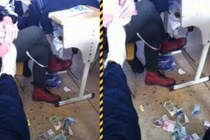 Trung Quốc: Nữ sinh cấp 2 dùng tiền… lau giầy