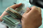 Tăng lương tối thiểu lên 1,15 triệu đồng/tháng từ 1.7.2013