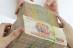 Thủ tướng yêu cầu điều tra, truy tìm thủ phạm tung tin đổi tiền 