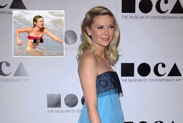 Kirsten Dunst cũng bị sóng đánh đến xộc xệch áo tắm như thế này vì bất cẩn.