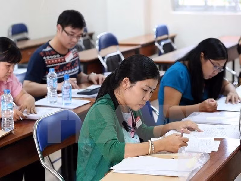 Chấm thi luôn được xem là một nhiệm vụ rất vất vả, nặng nề. (Ảnh minh họa: TTXVN) Chấm thi luôn được xem là một nhiệm vụ rất vất vả, nặng nề. (Ảnh minh họa: TTXVN)