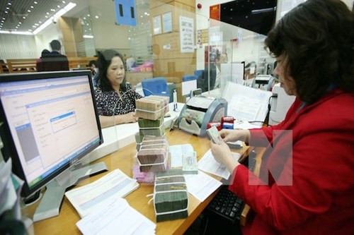 Bộ Chính trị ra Nghị quyết về nợ công là tiền đề quan trọng để đảm bảo an toàn tài chính quốc gia. ảnh minh họa: TTXVN. Bộ Chính trị ra Nghị quyết về nợ công là tiền đề quan trọng để đảm bảo an toàn tài chính quốc gia. ảnh minh họa: TTXVN.