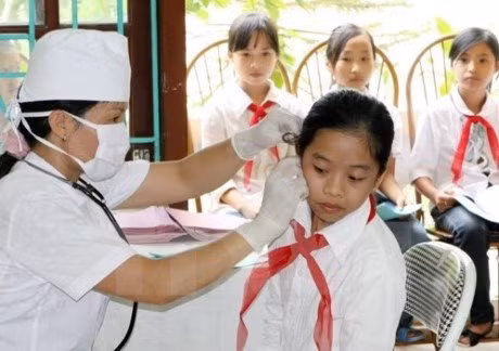 Phấn đấu để 100% học sinh sinh viên tham gia bảo hiểm y tế trong năm học mới (ảnh nguồn TTXVN).