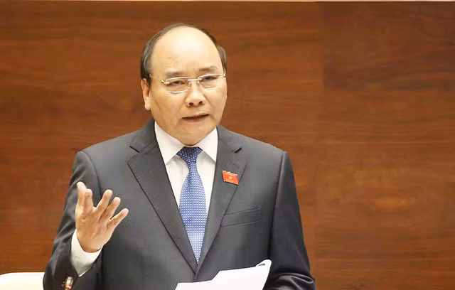 Thủ tướng Nguyễn Xuân Phúc đã có trả lời chất vấn của đại biểu Trần Thị Quốc Khánh. (Ảnh: Quochoi.vn)