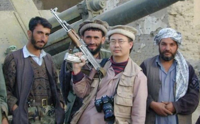 Andrei Chang (người cầm súng), ảnh: SCMP. Andrei Chang (người cầm súng), ảnh: SCMP.