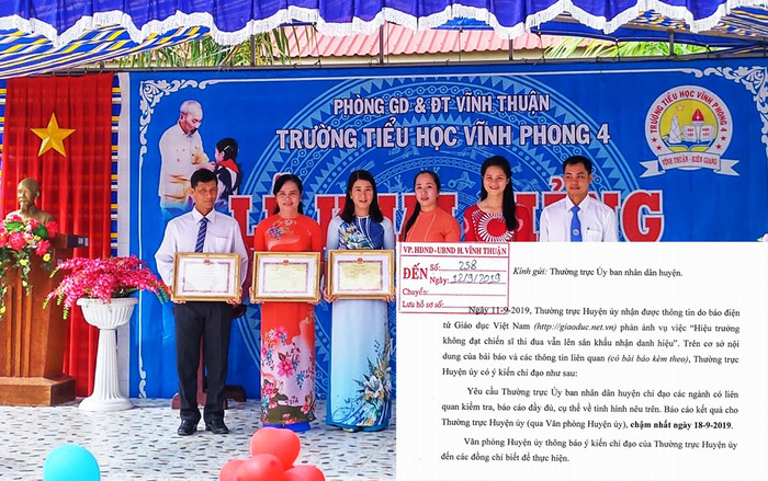 Cô Trịnh Ngọc Thuỳ Mai - Hiệu trưởng Trường Tiểu học Vĩnh Phong 4 (huyện Vĩnh Thuận, tỉnh Kiên Giang, thứ 2 từ trái sang) đã “diễn kịch” nhận giấy chứng nhận tặng thưởng danh hiệu Chiến sĩ thi đua trên lễ đài dù không đạt thành tích này. (Ảnh: c1vinhphong4.vinhthuan.edu.vn). Cô Trịnh Ngọc Thuỳ Mai - Hiệu trưởng Trường Tiểu học Vĩnh Phong 4 (huyện Vĩnh Thuận, tỉnh Kiên Giang, thứ 2 từ trái sang) đã “diễn kịch” nhận giấy chứng nhận tặng thưởng danh hiệu Chiến sĩ thi đua trên lễ đài dù không đạt thành tích này. (Ảnh: c1vinhphong4.vinhthuan.edu.vn).