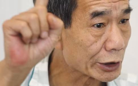 Nhà hoạt động chống tham nhũng Âu Thiếu Khôn, biệt danh "bác Âu" bị bắt "cùng gái mại dâm trong khách sạn". Ảnh: SCMP.