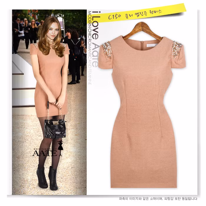 Váy thiết kế đơn giản nhưng phần họa tiết ở vai áo khiến nó đỡ đơn điệu.