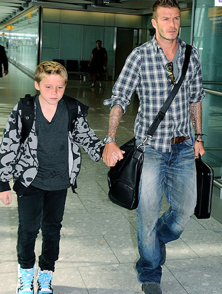 Nếu để ý kỹ một chút bạn có thể nhận ra Becks rất thích diện áo sơ mi kẻ ô. (Ảnh:CNN) Xem thêm: Vợ chồng Becks: từ quê mùa lên thành phố