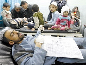 Dân thường Palestine bị thương sau vụ một không kích của Israel. (Nguồn: AFP)