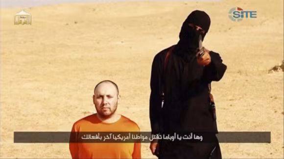Jihadi John trong đoạn video đe dọa sát hại con tin Steven Sotloff. Jihadi John trong đoạn video đe dọa sát hại con tin Steven Sotloff.