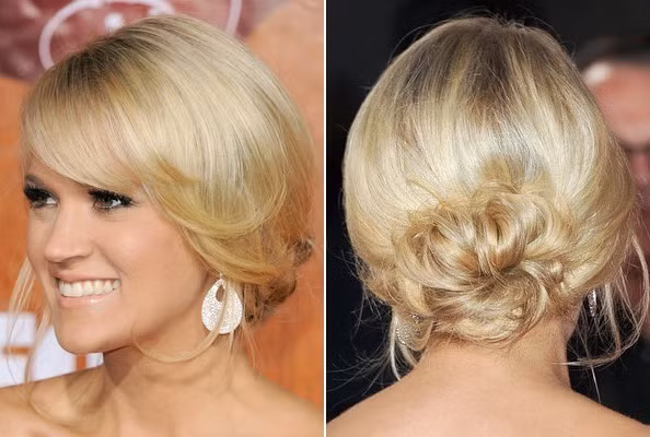 Carrie Underwood sở hữu mái tóc vàng óng tuyệt đẹp nên khi búi đơn giản sau gáy và để rủ tự nhiên ở phần mái đã đủ khiến phái mạnh ngẩn ngơ.