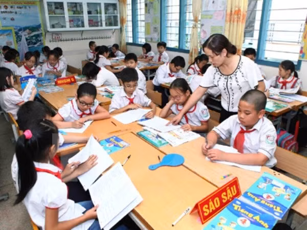 Đối tượng được miễn, giảm học phí (Ảnh: TTXVN)